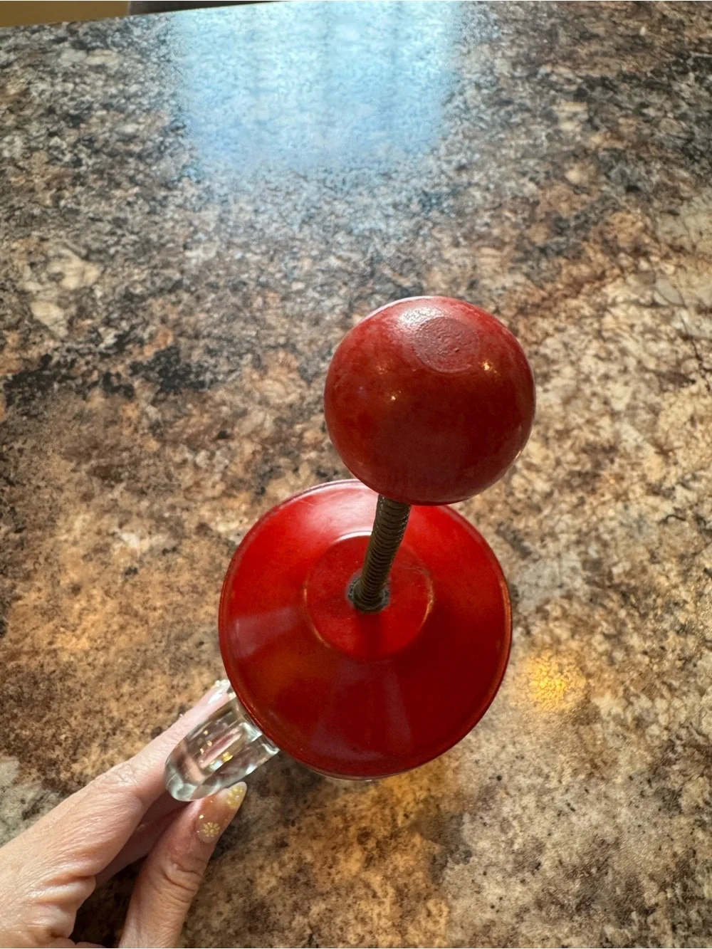 Vintage Hazel Atlas glass kitchen chopper with red lid and ball handle